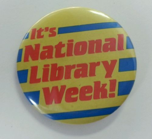 A striped button that says, "It's Nationa Library Week!"
