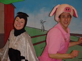 A woman dressed as a spider and a man dress as a pig, back to bak.