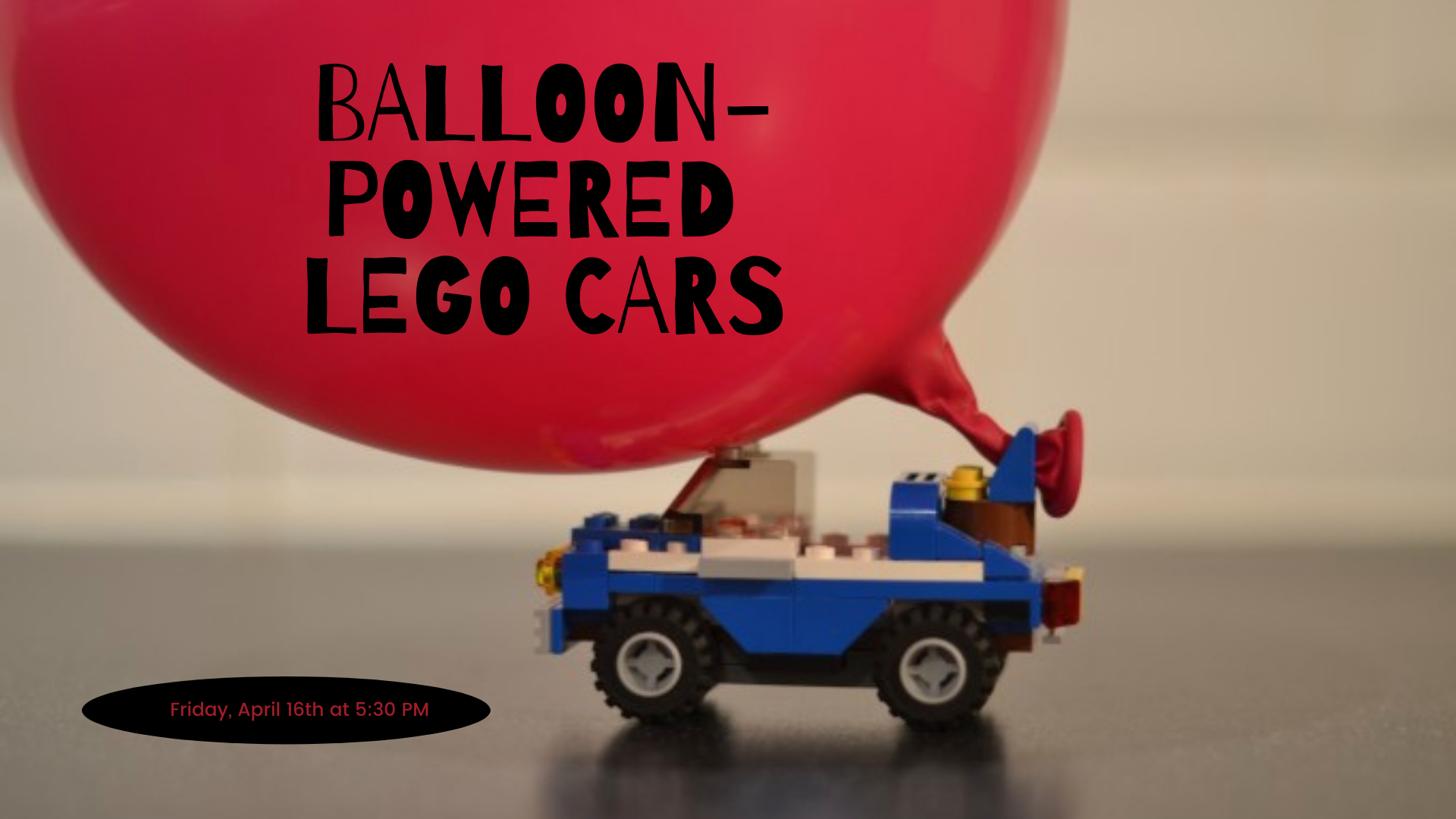 A car built our of Legos attached to an inflated balloon.
