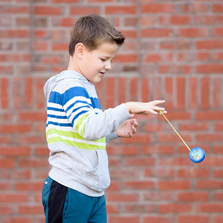 Boy playing with a yo-yo.