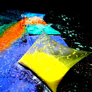 Colored liquid in puffed up plastic zipper bags.