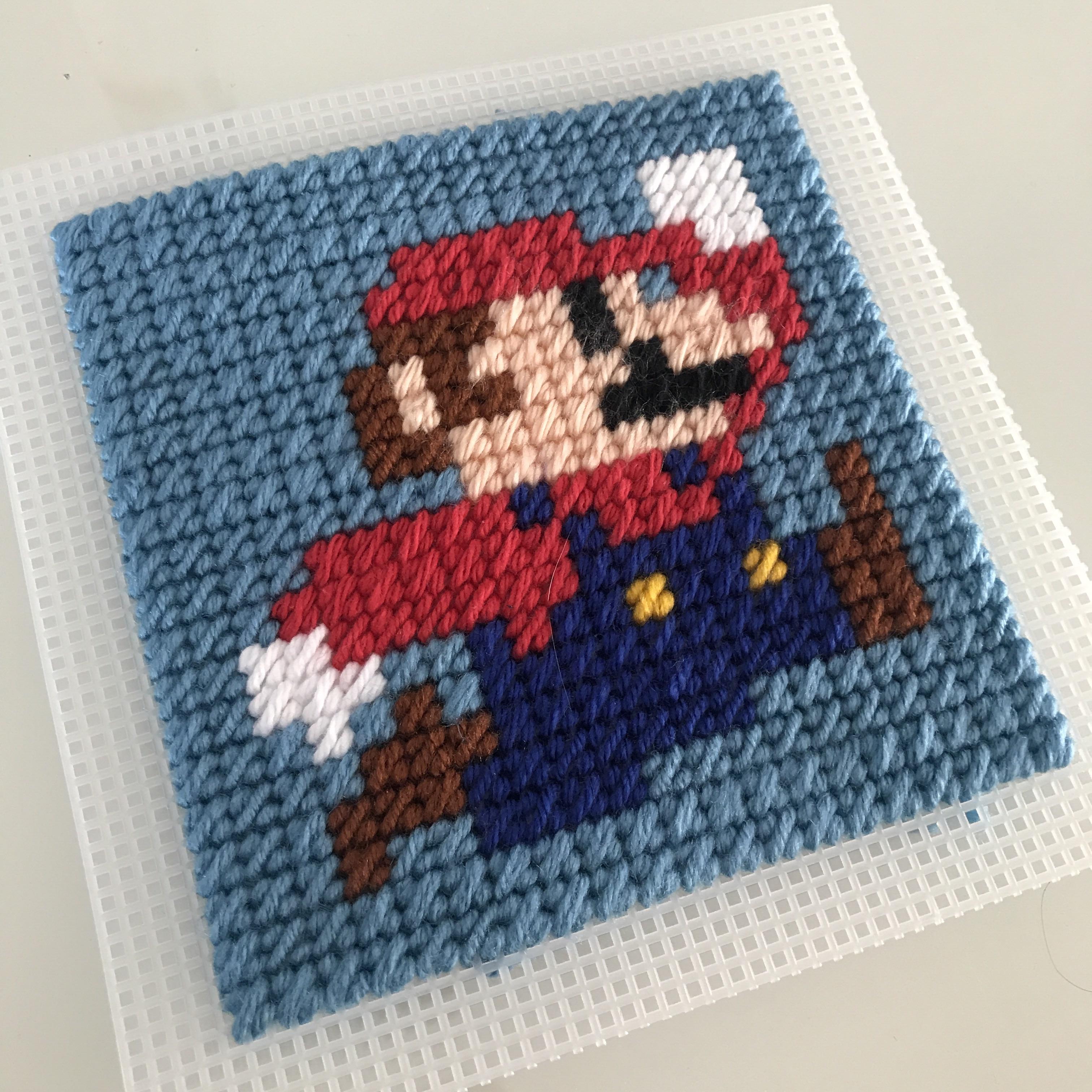 Mario cross-stitched onto plastic canvas