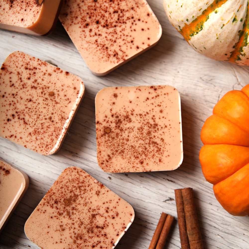 Mulitiple bars of soap with pumpkin spice sprinkled on top.