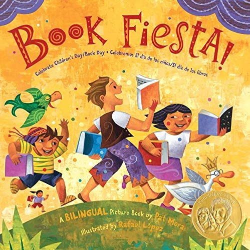 Children walking outdoors, holding books.  It's a book fiesta.