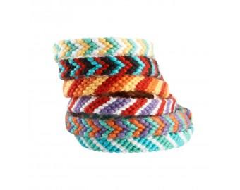 A stack of bracelets woven with embroidery string.