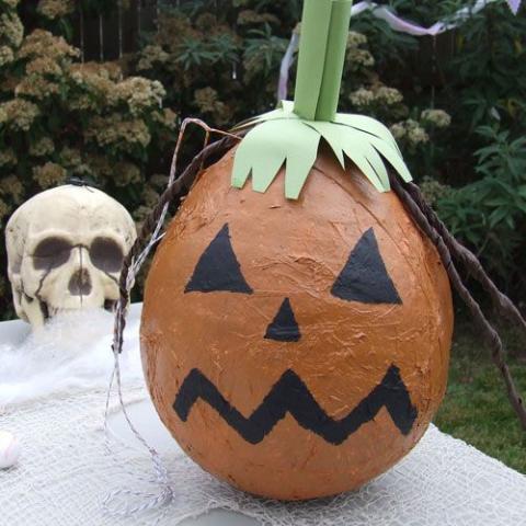 A pumpkin-shaped pinata