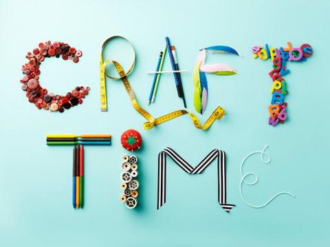 The words "craft time" spelled out in craft supplies.