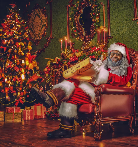 Santa Claus sitting in an ornately decorated room.