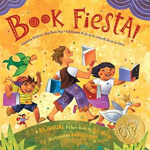 Children walking outdoors, holding books.  It's a book fiesta.