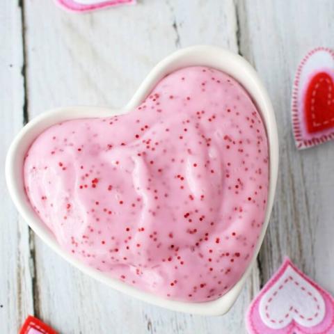 Glitter slime in a heart-shaped bowl.