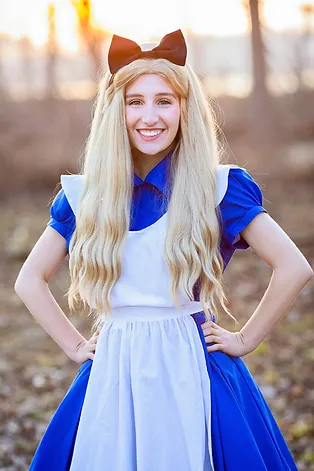 Women dress as Alice in Wonderland