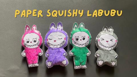 Four Labubus made out of paper.