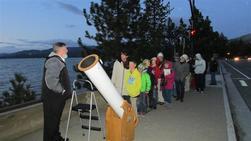 Group of people with a telescope