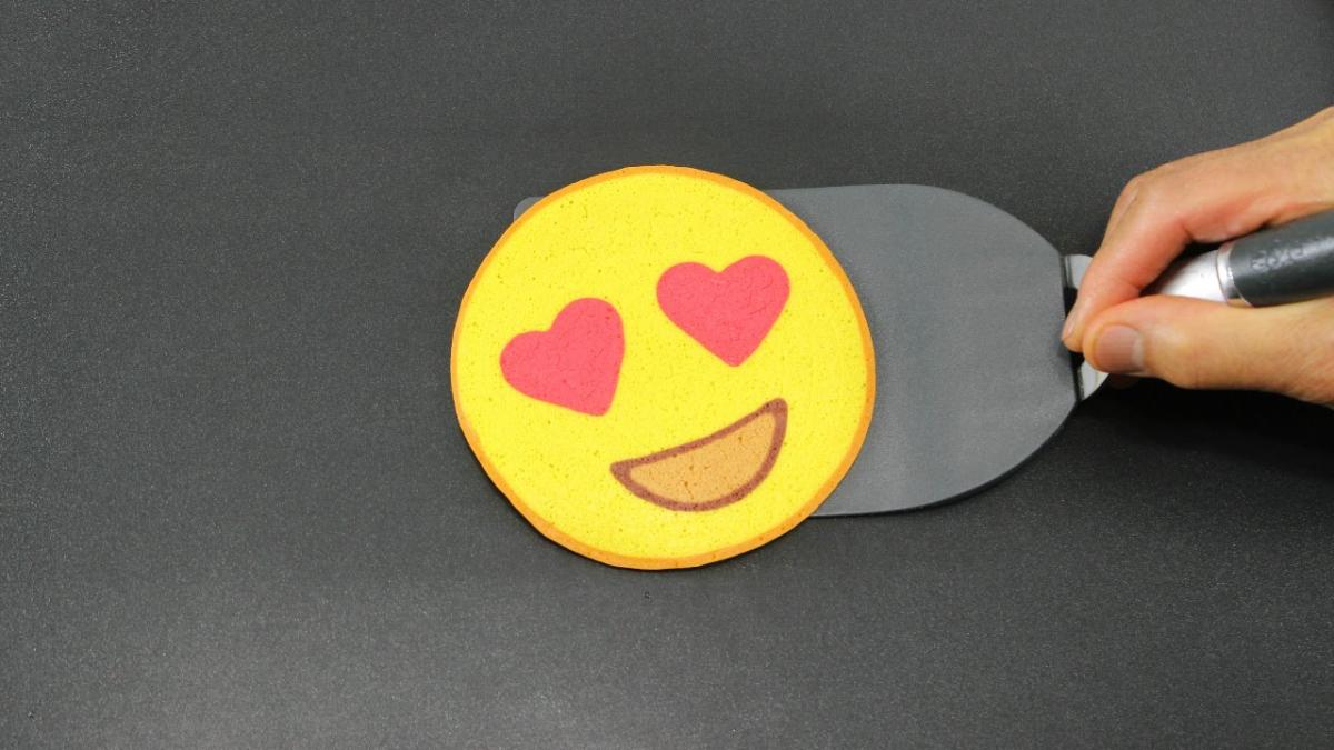 A pancake that looks like an emoji with heart-shaped eyes.