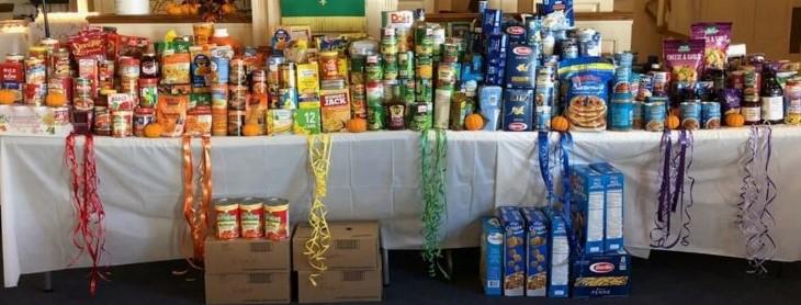 Table with nonperishable food on it, organized by color